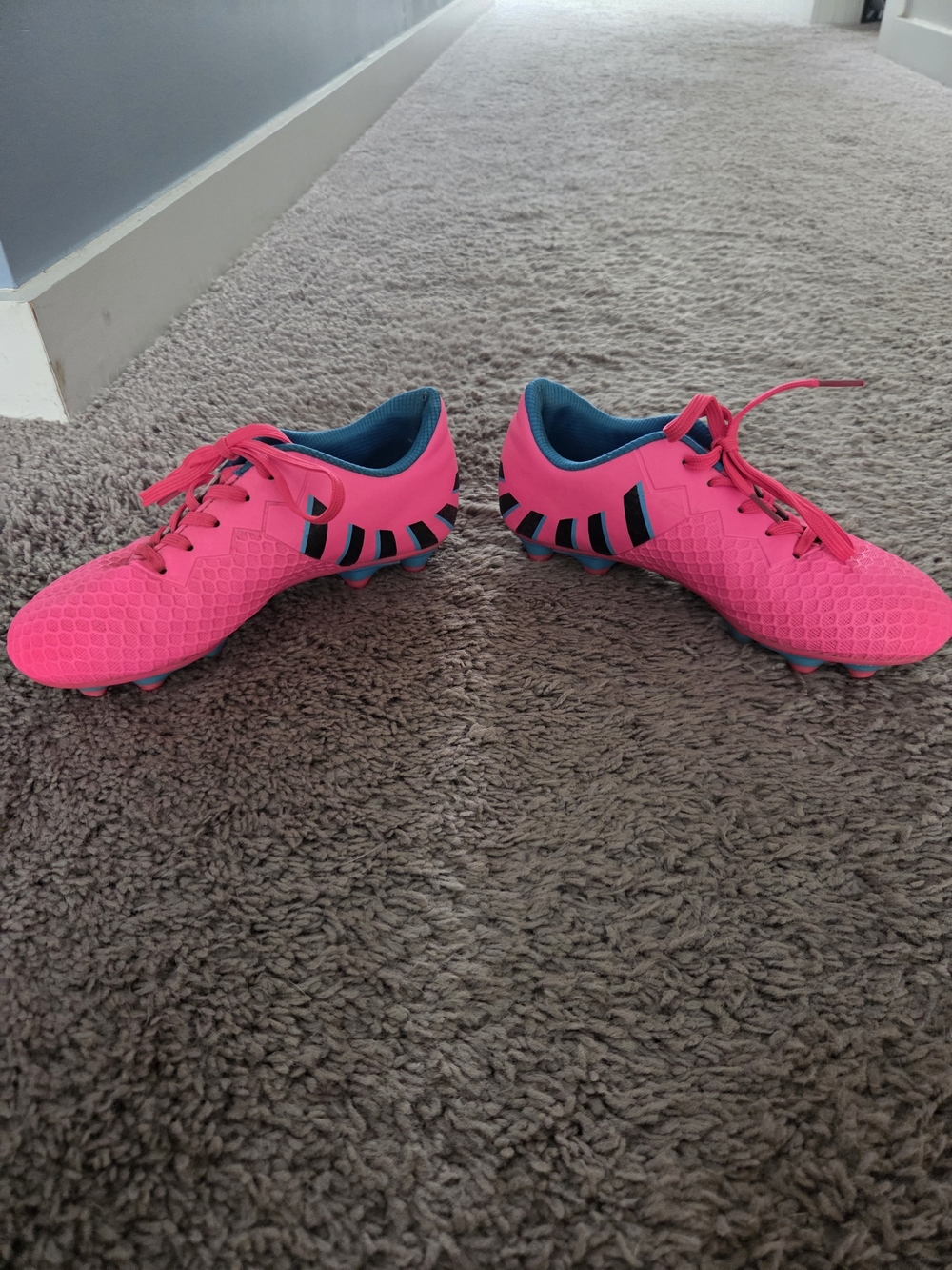 Kids Pink Soccer Cleats with Black Accent Stripes